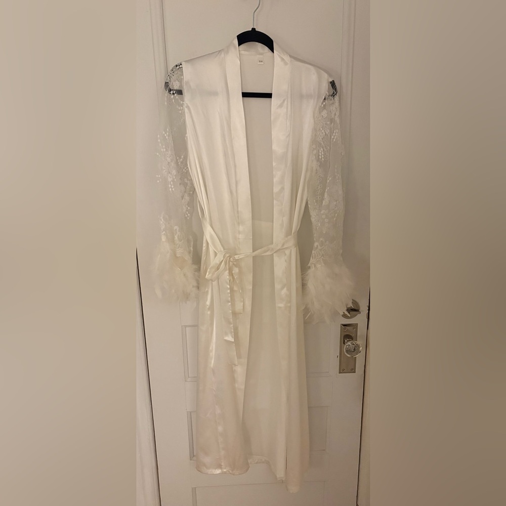 White poly satin knee-length robe with lace sleeves and removable feather cuffs